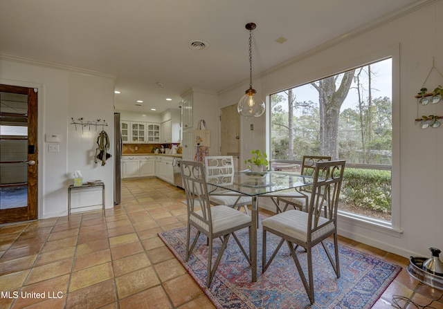 dining area featuring ornamental molding