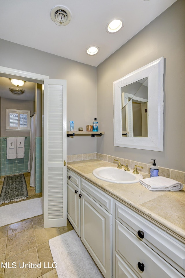 bathroom with vanity and tile patterned floors