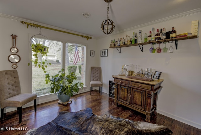 sitting room with dark wood-type flooring and ornamental molding