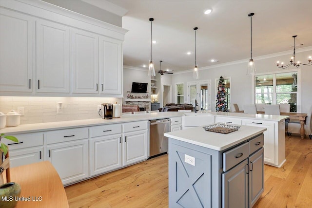 221 Lost Oak Ln, Brandon, MS 39047 - kitchen with stainless steel dishwasher, a chandelier, a kitchen island, gray cabinets, and crown molding