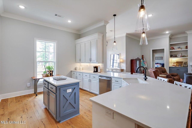 221 Lost Oak Ln, Brandon, MS 39047 - kitchen featuring a sink, dishwasher, white cabinetry, a kitchen island, and ornamental molding
