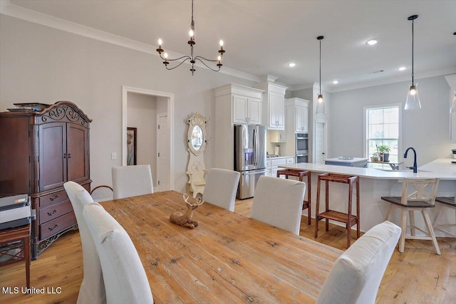 221 Lost Oak Ln, Brandon, MS 39047 - dining area with crown molding, light wood-style flooring, a chandelier, and recessed lighting