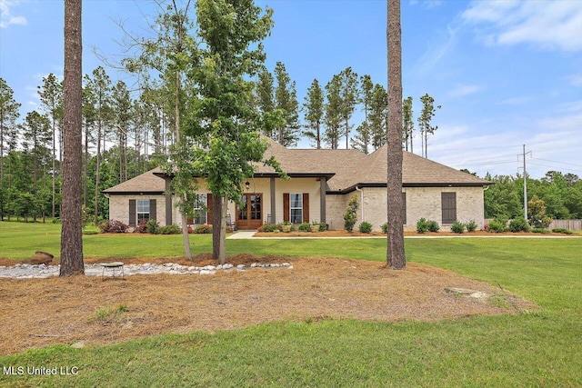 221 Lost Oak Ln, Brandon, MS 39047 - view of front of house with french doors, a front lawn, brick siding, and a shingled roof