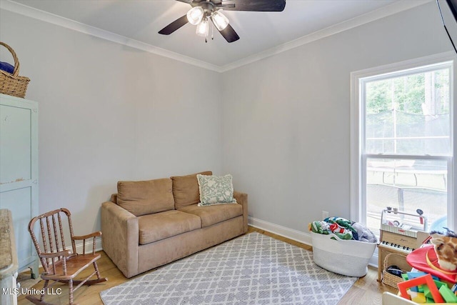 221 Lost Oak Ln, Brandon, MS 39047 - living area featuring ceiling fan, light wood finished floors, crown molding, and baseboards