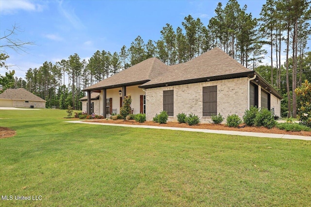 221 Lost Oak Ln, Brandon, MS 39047 - view of front facade featuring a front lawn and brick siding