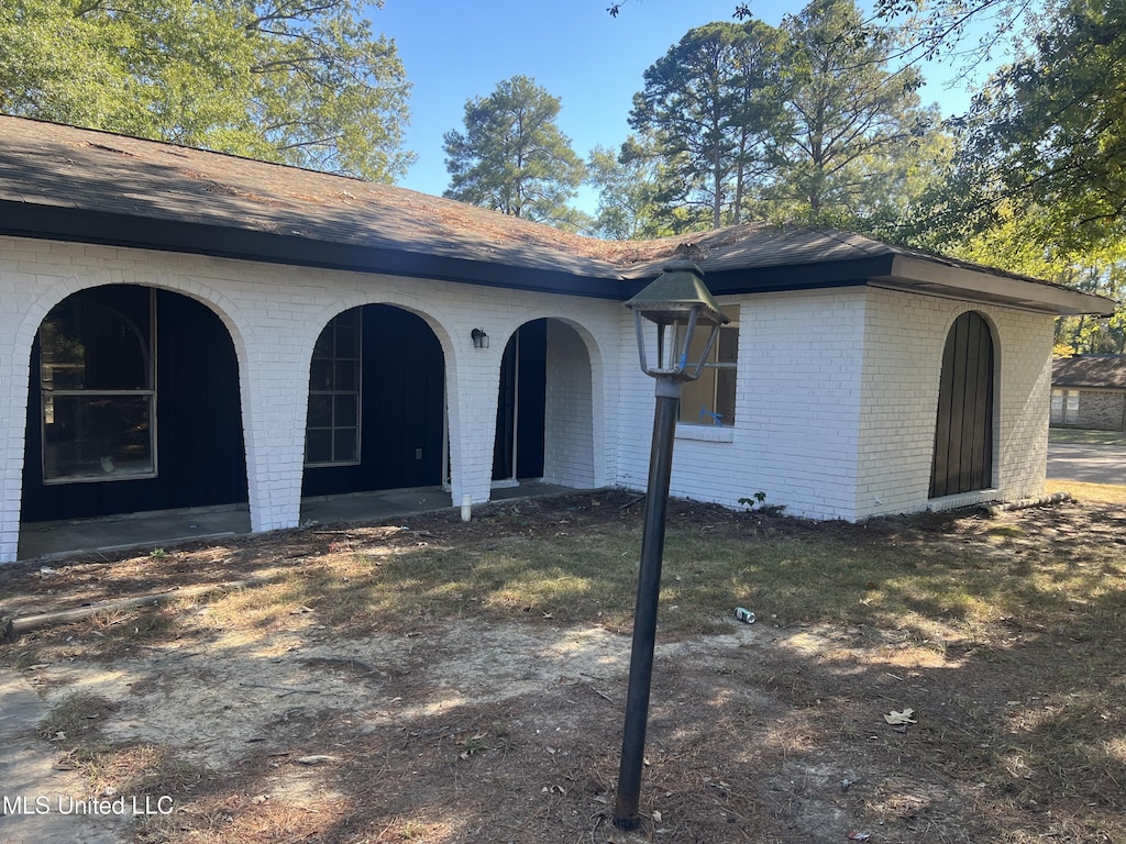 exterior space with brick siding