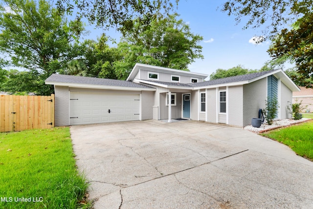 3106 Breezy Hill Ln, Ocean Springs, MS 39564 - traditional-style house with an attached garage, brick siding, and concrete driveway