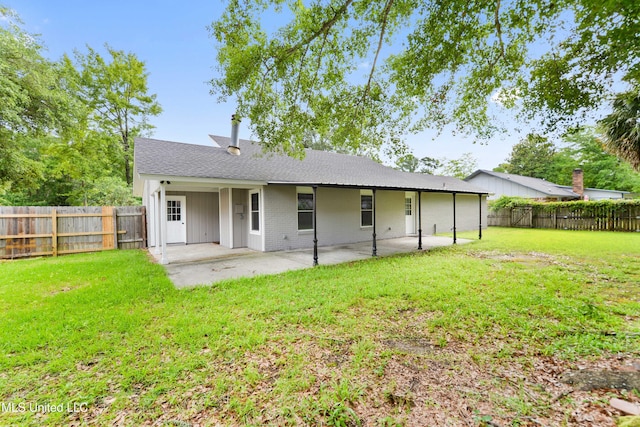 3106 Breezy Hill Ln, Ocean Springs, MS 39564 - rear view of house featuring a patio area, a fenced backyard, and brick siding