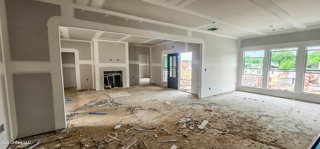 unfurnished living room with visible vents and a fireplace