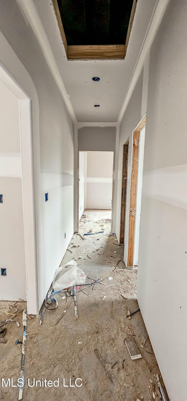 hallway featuring ornamental molding