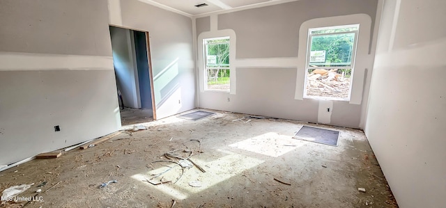 spare room with visible vents and a healthy amount of sunlight