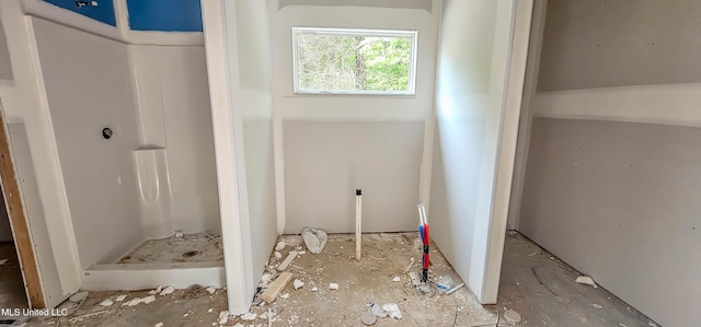 full bath featuring a shower stall