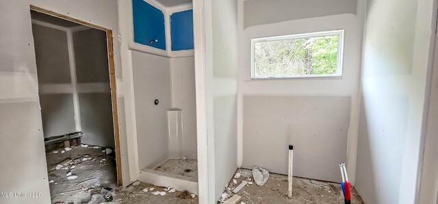 full bathroom with a stall shower