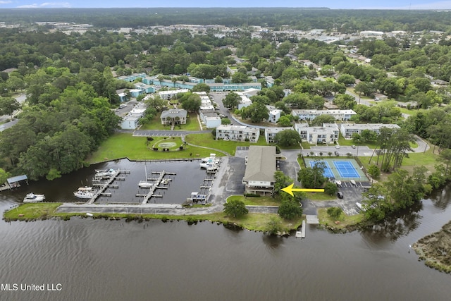 birds eye view of property with a water view