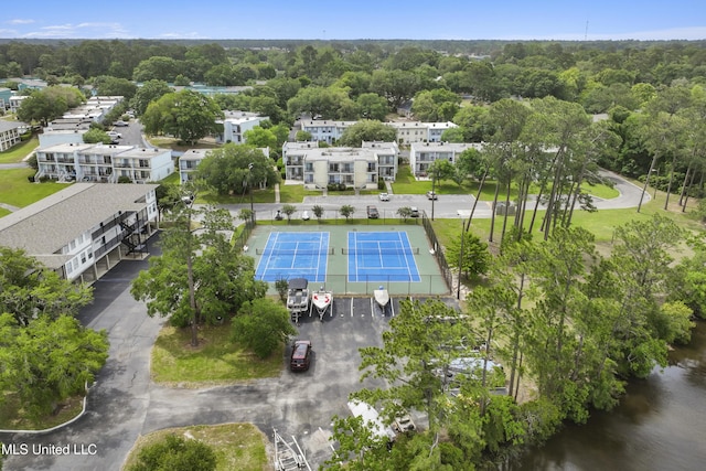 birds eye view of property with a forest view