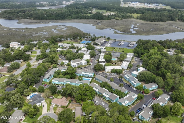 drone / aerial view with a residential view and a water view