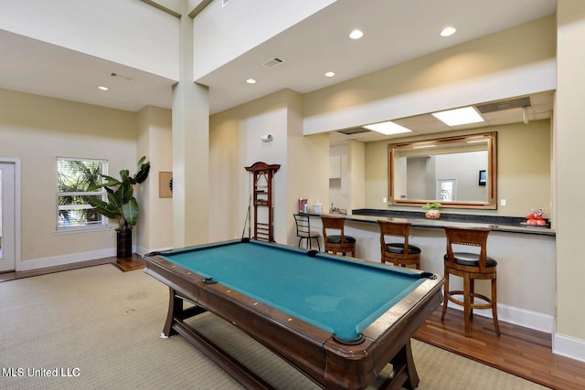 rec room with recessed lighting, visible vents, baseboards, and wood finished floors