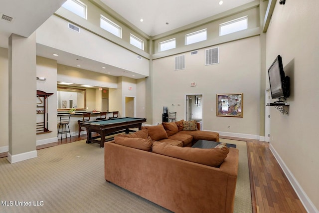 living area featuring visible vents, pool table, baseboards, and wood-type flooring