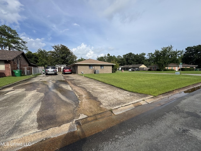 15708 Orleans Dr, Biloxi, MS 39532 - ranch-style house featuring a front yard, asphalt driveway, and brick siding
