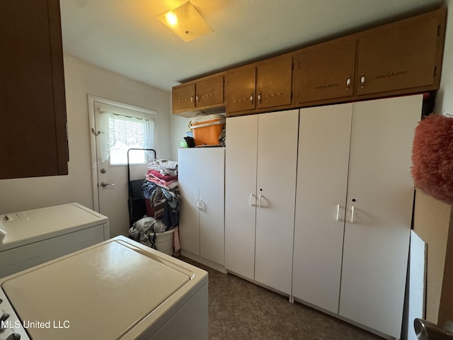 15708 Orleans Dr, Biloxi, MS 39532 - laundry area with cabinet space and washing machine and clothes dryer