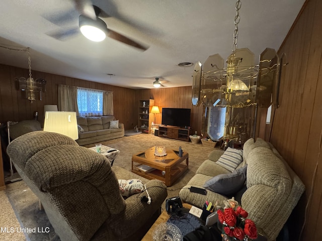15708 Orleans Dr, Biloxi, MS 39532 - living area with wood walls, ceiling fan, and carpet