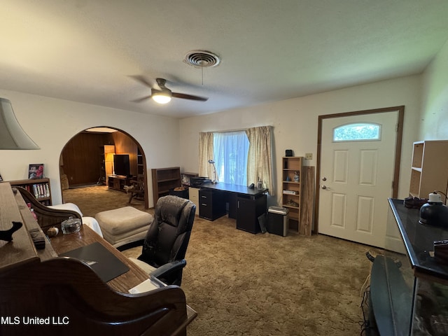 15708 Orleans Dr, Biloxi, MS 39532 - office with arched walkways, carpet flooring, and ceiling fan