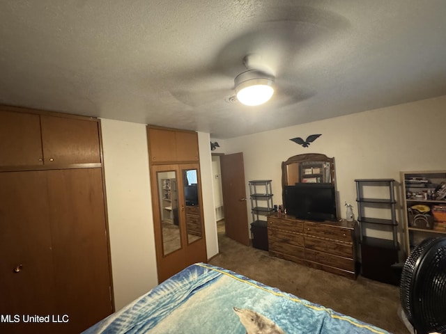 15708 Orleans Dr, Biloxi, MS 39532 - bedroom featuring carpet flooring, a textured ceiling, and a ceiling fan