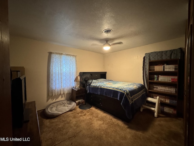 15708 Orleans Dr, Biloxi, MS 39532 - carpeted bedroom featuring a textured ceiling and ceiling fan