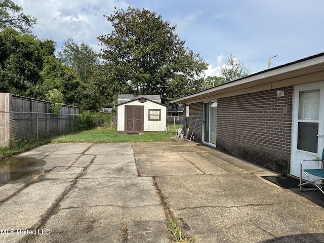 15708 Orleans Dr, Biloxi, MS 39532 - view of patio / terrace with a storage unit