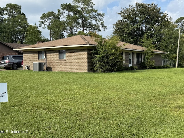 15708 Orleans Dr, Biloxi, MS 39532 - view of property exterior featuring a lawn and brick siding