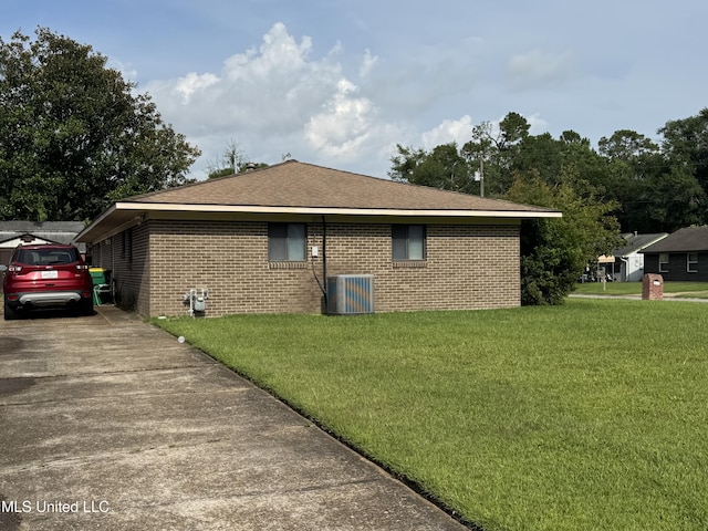 15708 Orleans Dr, Biloxi, MS 39532 - view of side of home featuring brick siding, a lawn, driveway, and a shingled roof