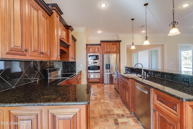 kitchen with tasteful backsplash, stainless steel appliances, sink, dark stone countertops, and hanging light fixtures