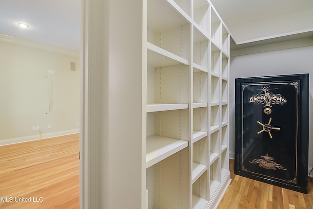 room details featuring ornamental molding and hardwood / wood-style flooring