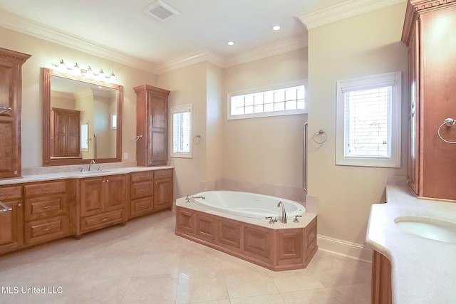 bathroom featuring tile patterned floors, vanity, a tub, and ornamental molding