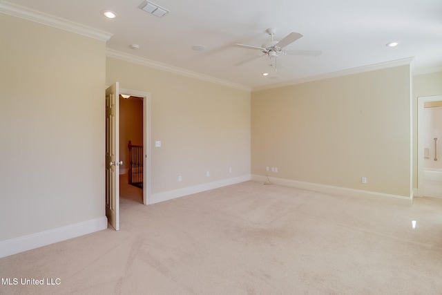 carpeted empty room with ceiling fan and ornamental molding