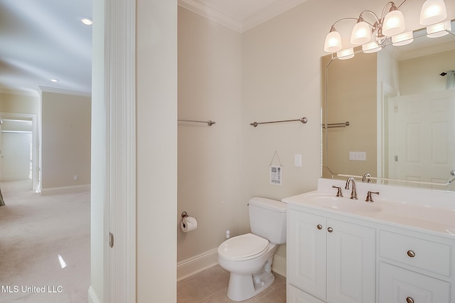 bathroom featuring crown molding, tile patterned flooring, vanity, and toilet