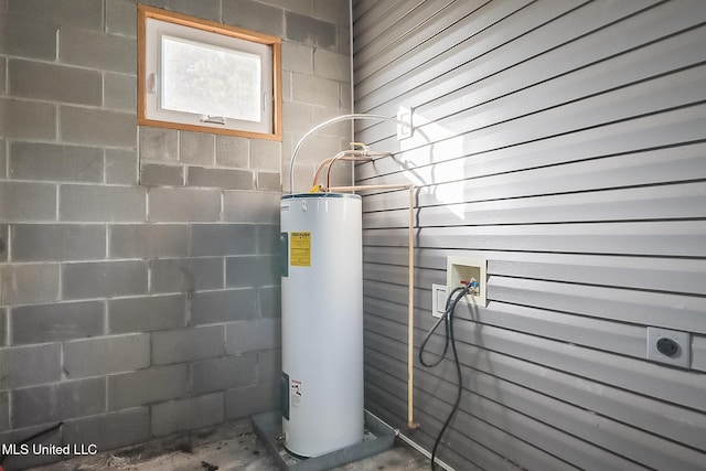 utility room featuring electric water heater