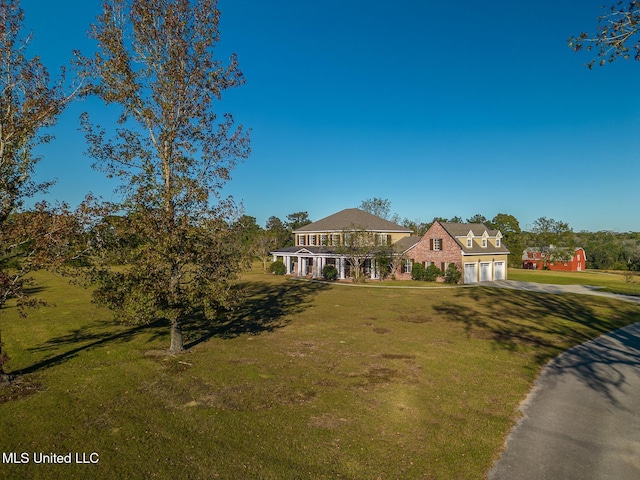 view of front of home with a front lawn