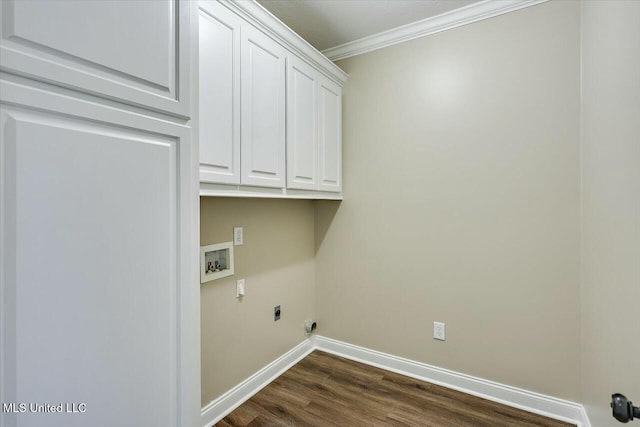 laundry room with cabinet space, baseboards, crown molding, washer hookup, and electric dryer hookup