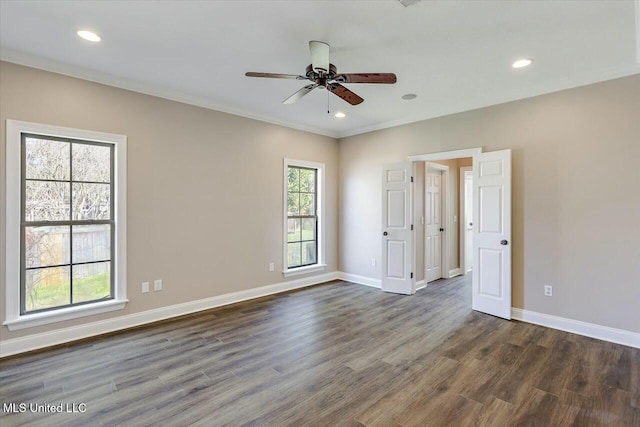 unfurnished room with dark wood-style flooring, recessed lighting, and baseboards