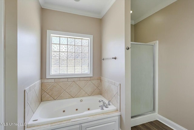 full bathroom featuring a stall shower, crown molding, a tub with jets, and wood finished floors