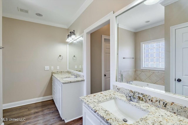 bathroom with two vanities, a sink, visible vents, and crown molding