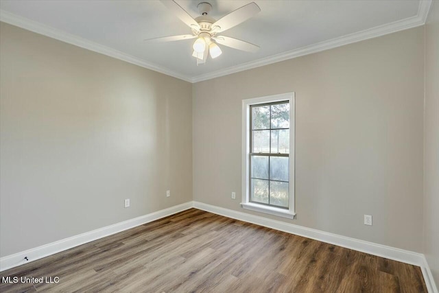 empty room featuring a ceiling fan, crown molding, baseboards, and wood finished floors