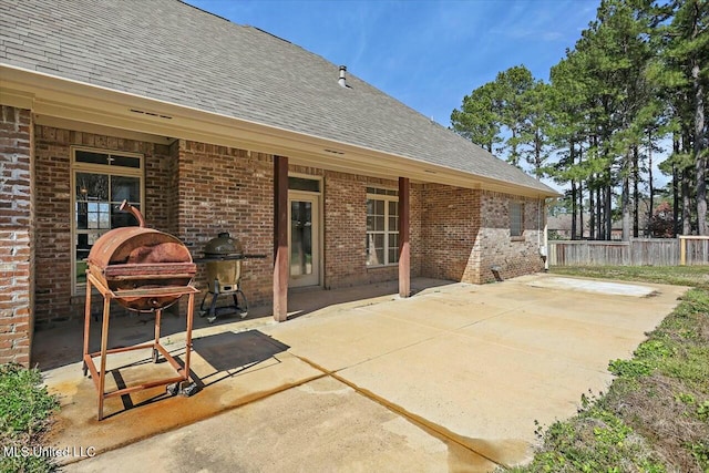 view of patio / terrace featuring fence