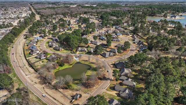 birds eye view of property featuring a water view and a residential view