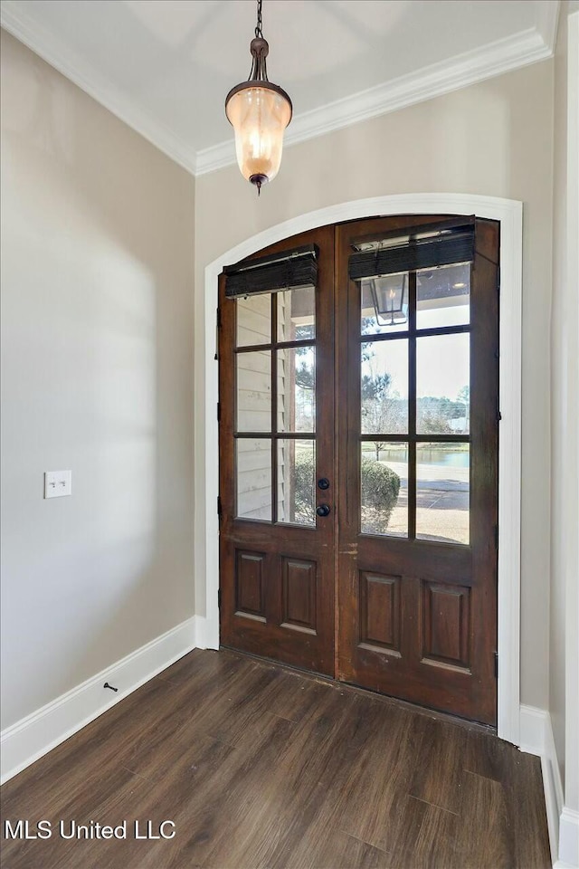 entrance foyer with baseboards, french doors, dark wood-style flooring, and crown molding