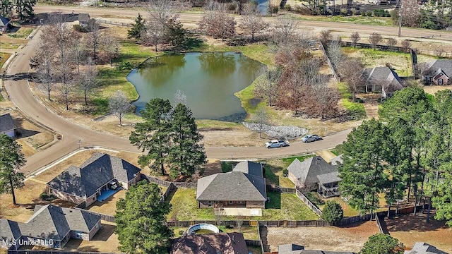 drone / aerial view featuring a residential view and a water view