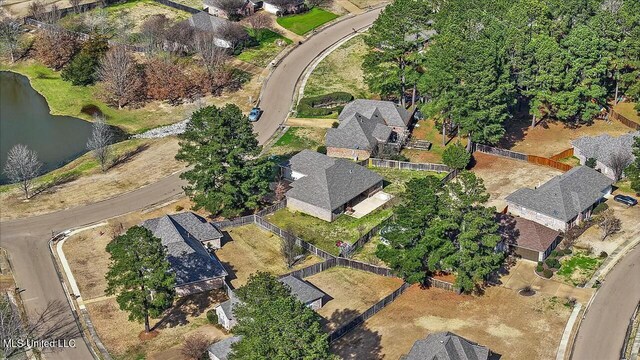 drone / aerial view featuring a water view and a residential view