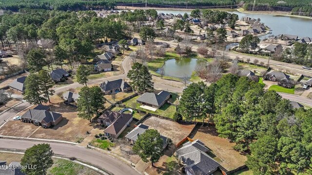 bird's eye view featuring a water view and a residential view