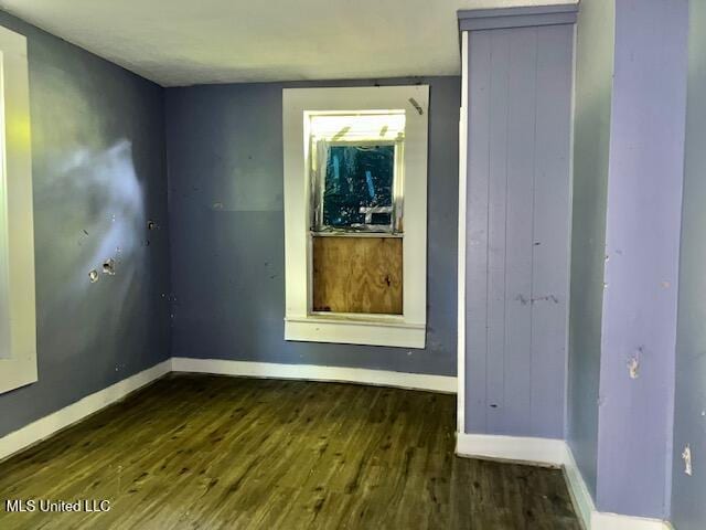 721 Adams St, Vicksburg, MS 39183 - spare room featuring wood finished floors and baseboards